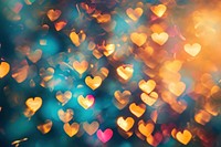 Abstract heart pattern bokeh effect background backgrounds light gold.