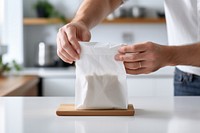 Coffee bag kitchen hand food. AI generated Image by rawpixel.