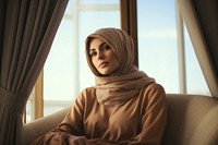 Portrait sitting hijab adult.