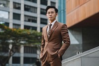 Asian businessman in a brown suit blazer adult tie.
