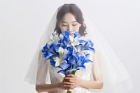 Happy bride holding a blue iris flower bouquet portrait fashion wedding.
