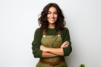 A happy female gardener crossing her arms adult smile white background.