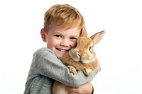 A young boy hugging a rabbit portrait mammal animal.