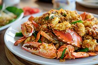 Crab with curry powder seafood fried plate. AI generated Image by rawpixel.