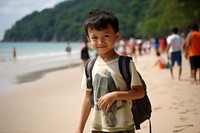 Malaysian kid beach portrait outdoors.