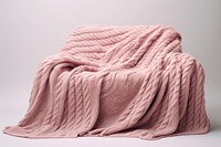 Pink knitted blanket relaxation furniture material.
