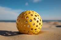 Yellow beach ball outdoors sports hole.