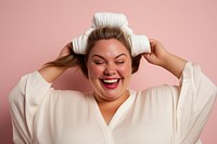 Chubby woman tying her hair with rubber band smile laughing adult. AI generated Image by rawpixel.