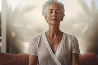 Mature woman meditating adult contemplation spirituality. AI generated Image by rawpixel.