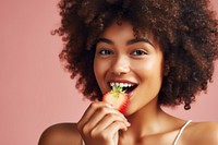 Eating strawberry biting adult smile. AI generated Image by rawpixel.