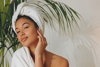 Pacific Islander woman doing skincare routine adult relaxation hairstyle.