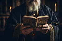 Priest holding bible reading priest spirituality. 