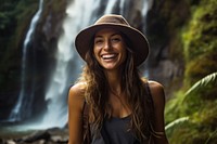 Columbian woman outdoors waterfall laughing.