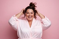 Chubby woman tying her hair with rubber band smile portrait laughing. AI generated Image by rawpixel.