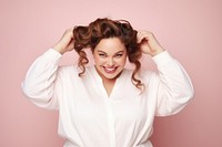 Chubby woman tying her hair with rubber band portrait smile adult. AI generated Image by rawpixel.