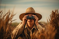Man using Binoculars binoculars portrait adult. AI generated Image by rawpixel.