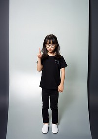 Shh gesture t-shirt footwear standing. AI generated Image by rawpixel.