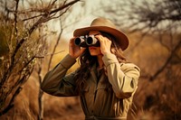 Woman using Binoculars binoculars adult photo. AI generated Image by rawpixel.