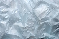  Clear crumpled plastic bag backgrounds paper textured. AI generated Image by rawpixel.