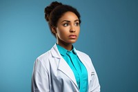 African female doctor looking up with arms crossed portrait adult photo.