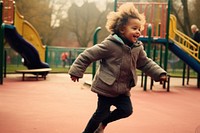 Kid running at playground outdoors child park.