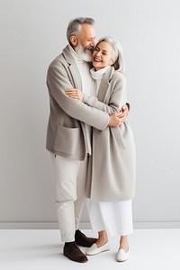 Couple standing overcoat portrait.