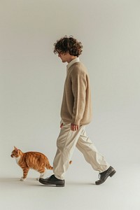 A person with a cat footwear walking mammal.