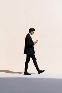 A person holding phone walking footwear standing.