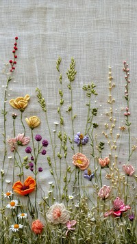Embroidery with meadow flowers needlework textile pattern.