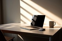 Computer white wallpaper on working desk furniture laptop table.