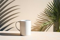 White mug shadow coffee wall.