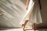 Female wearing  white apron footwear shadow dress.
