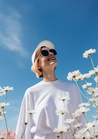 Happy Mature woman wearing white outfit sunglasses flower adult.