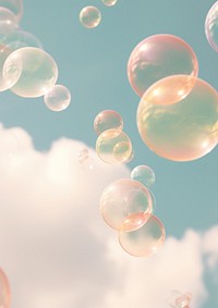A group of soap bubbles floating in the cloud sky backgrounds outdoors nature.