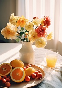 Beautiful flower bouquet and fresh fruits on tabletop grapefruit brunch juice. AI generated Image by rawpixel.