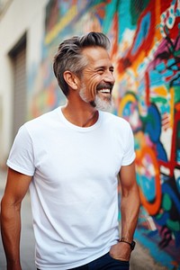 Happy american middle age man wearing white t-shirt laughing adult smile.