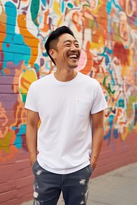 Happy asian american middle age man wearing white t-shirt laughing smile adult.