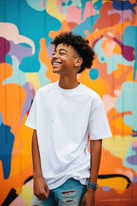 A kid wearing white t-shirt smile fun individuality.