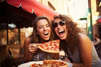 Eating pizza laughing glasses female. 