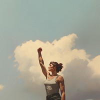 Woman raising a fist sky outdoors adult.
