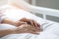 Nurse hand holding patient bed relaxation. AI generated Image by rawpixel.