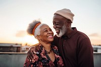 Black senior people couple having romantic moment embracing laughing portrait. AI generated Image by rawpixel.