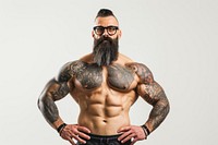 Exercise teacher showing off his big muscles tattoo beard torso.