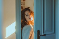 Woman Opening Door Welcoming standing adult woman.