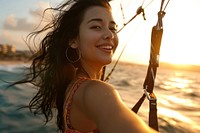  Parasailing portrait outdoors sunset. AI generated Image by rawpixel.