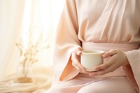Hands holding japanese tea cup coffee drink robe. AI generated Image by rawpixel.