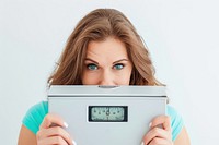 Woman with weighing machine exercising technology hairstyle.
