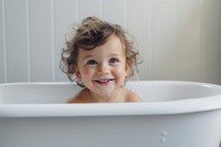 A young child bathtub photography portrait.