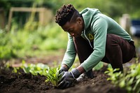 Black people gardening harvesting outdoors.