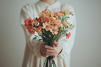 Person holding flowers petal plant adult.